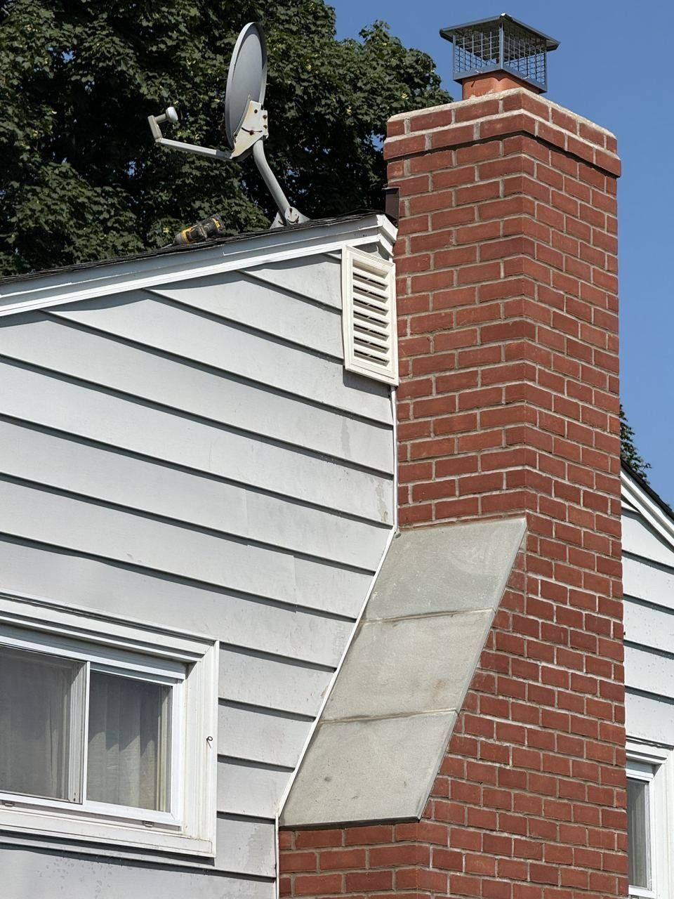Brick chimney with new cap and flashing