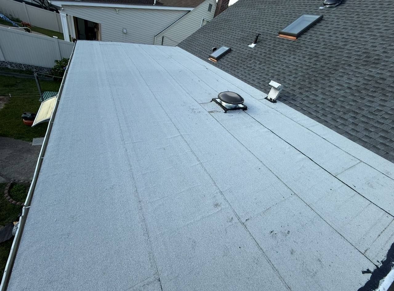 Flat roof with skylights and solar fan - after