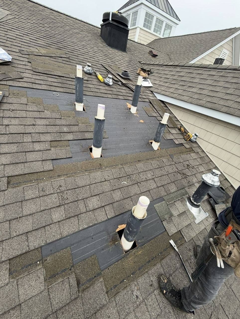 Roof vent pipes re-flashed - before